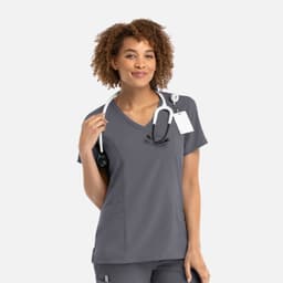 A women's mock wrap top in grey with a v-neck design, featuring a logo and a stethoscope.
