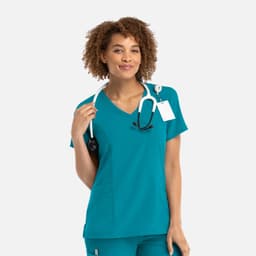 A teal women's mock wrap top, featuring a V-neck and a stethoscope, with a tag attached and a logo.