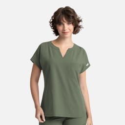 A women's olive green dolman top featuring a V-neck and three pockets, with a logo on the side.