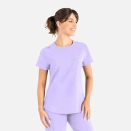 A purple round neck scrub top with a pocket, featuring a small logo and short sleeves.