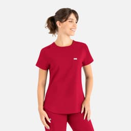 A red round neck top featuring short sleeves, a pocket, and a logo on the chest, designed as part of uniform scrubs.
