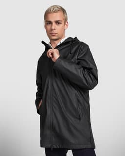 A black waterproof raincoat with a hood, featuring side pockets and a clean design. The model is standing with one hand on the zipper.