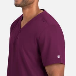 A men's tuckable henley top in a rich burgundy colour, featuring a logo. Side view highlighting the neckline and sleeve.