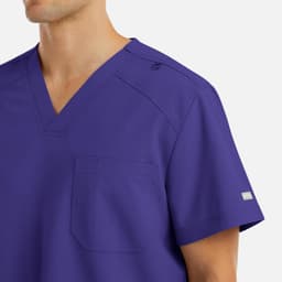 A purple men's V-neck top featuring a pocket and shoulder snap detail, with a logo on the sleeve.