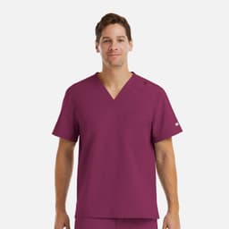 A men's tuckable v-neck top in a rich burgundy colour, featuring a pocket and a logo on the sleeve.