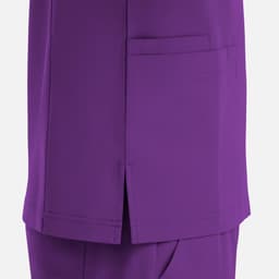 A purple V-neck top featuring four pockets and side slits at the hem. The design is simple and functional.