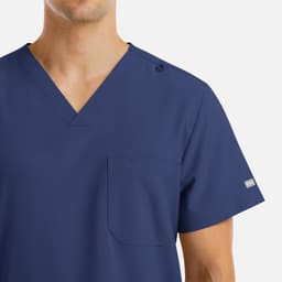 A navy blue men's V-neck top with four pockets and a logo on the sleeve.