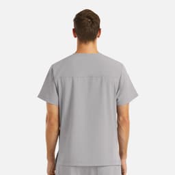 A grey V-neck top with four pockets, featuring a back yoke detail and a logo.