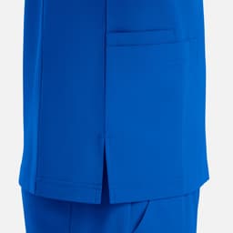 A bright blue V-neck top featuring four pockets and a side slit. It has a logo on the fabric.
