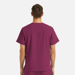 A men's v-neck top in plum with four pockets, featuring a plain back design and a logo.