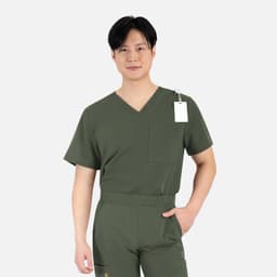 A men's dark green V-neck top with a chest pocket, featuring a tag and contrast piping details.
