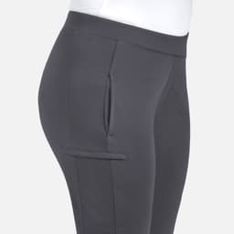 Mid-rise tapered pants in dark grey with side pockets and a fitted silhouette. Features a logo on the waistband.