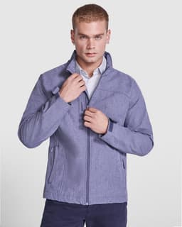 A softshell jacket in a light blue hue, featuring a zipped front and a stand-up collar, worn by a model.