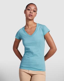 A teal v-neck t-shirt on a model with short hair, featuring a fitted style and a small logo.