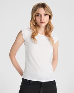 A fitted white T-shirt featuring short sleeves, paired with black jeans. The shirt has a branding logo.