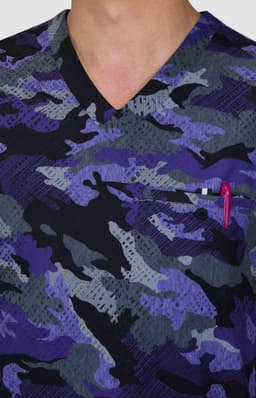 A scrub top featuring a purple and grey camouflage design with a v-neck and a chest pocket holding a pen.