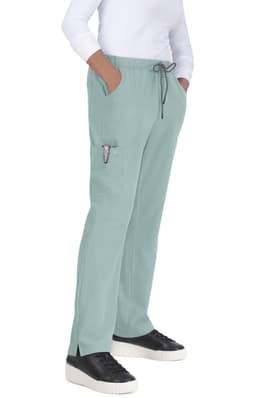 Everyday Hero Pant in a soft green colour, featuring a drawstring waist and side pockets, worn by a model.