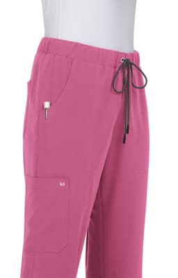 A pair of pink pants featuring an elastic waistband, drawstring, and pockets. The product has a logo on it.