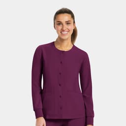 A round neck snap jacket in a rich purple colour featuring long sleeves and front pockets, with a logo.
