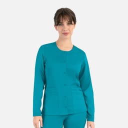A women's round neck snap jacket in teal, featuring long sleeves and front pockets. It has a logo on the garment.