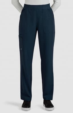 Navy boot cut pants with two front pockets and a side pocket, displayed on a model. Features a subtle logo.