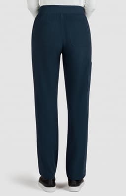 A pair of navy boot cut pants featuring a waistband and side pockets, viewed from the back.