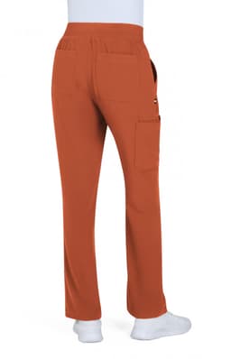 A pair of boot cut pants in a warm orange colour, featuring pockets and a comfortable waistband.