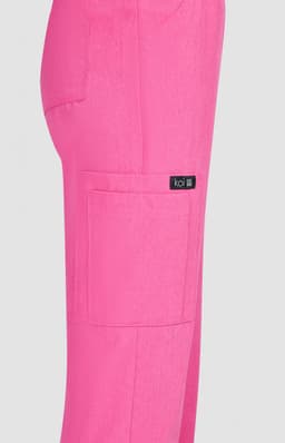 A pair of bright pink pants with a side pocket and a logo tag.