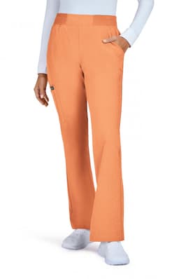 An orange pair of pants with a flared design, featuring side pockets and a branding logo.