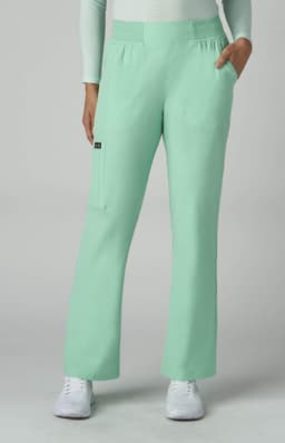 A pair of mint green pants with pockets, displayed on a model wearing a white top and white shoes.