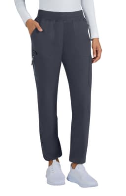 A pair of limited edition navy pants with pockets, featured on a model wearing a white top and white shoes.