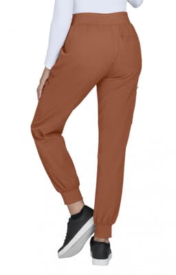 A pair of brown jogger pants with elastic cuffs and pockets, featuring a person wearing them from the back.