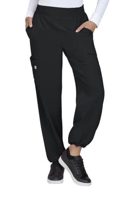 Black pants with pockets, featuring an elasticised waistband and cuffed hems, worn with a white long-sleeve top and black shoes.