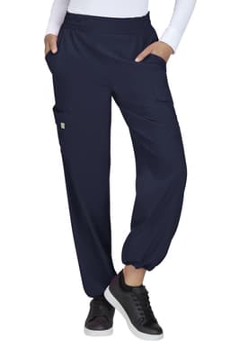 Navy blue cargo pants with elastic cuffs and side pockets, worn by a model. Features a logo on the garment.