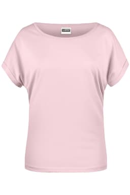 A light pink short-sleeved women's T-shirt with a relaxed fit, featuring a logo on the label.