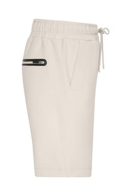 A pair of cream sports shorts featuring an elastic waistband and a side pocket with a zip.