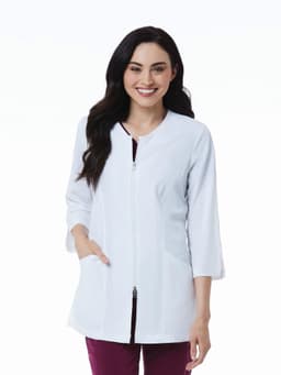 A woman wearing a white 3/4 sleeve lab jacket with a zip and side pockets, featuring a logo.