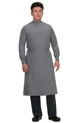 A clinical cover gown in grey, featuring long sleeves and a high neckline, worn by a model.
