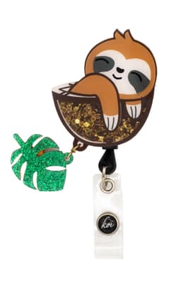 A sloth-shaped shaker badge with glitter and a green leaf charm, featuring a logo on the bottom.