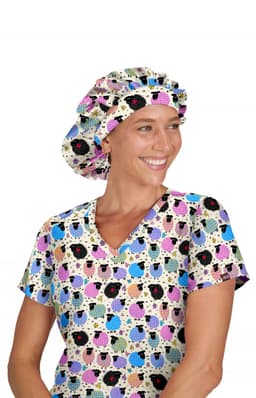 A woman wearing a colourful bouffant cap with a playful pattern, paired with a matching patterned top.