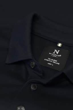 A navy polo shirt with short sleeves, featuring a collar, buttons, and a label indicating size and material.