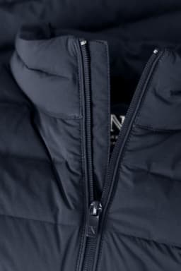 A navy blue women's down jacket with a zippered front and a hood. The fabric has a quilted texture.