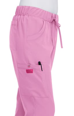 A pair of pink pants with an elastic waistband, pockets, and a logo on the side.