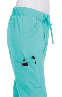 A pair of turquoise pants with an elastic waistband and a side pocket, featuring a logo on the leg.
