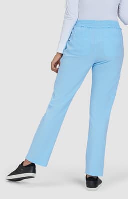 Light blue pants with a relaxed fit and an elastic waistband, featuring pockets, against a plain background.