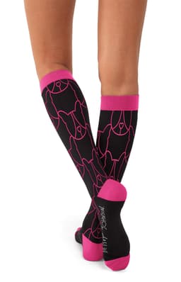 A pair of black compression socks with pink detailing, featuring a dog design and a logo.