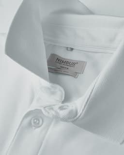 A white polo shirt with a collar and button placket, featuring a logo on the label inside.