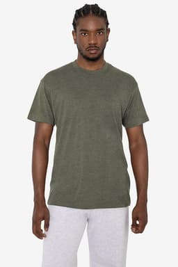A green short sleeve cotton-poly crew tee displayed on a model. The shirt features a logo on the front.