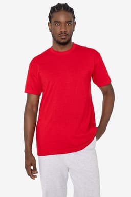 A red short sleeve cotton-poly crew tee on a model, featuring a casual fit and intricate detailing.