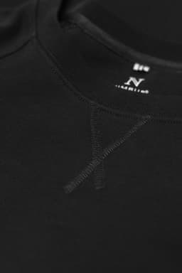 A black sweatshirt featuring a logo and a textured detail on the neckline.